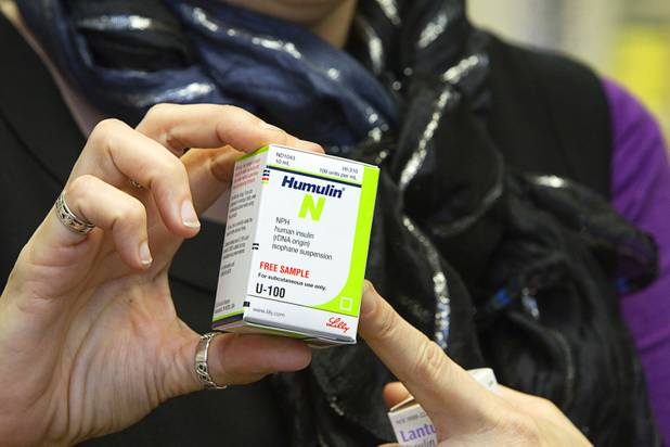 Dispensary manager Amy Rose Wojciechowski holds a box containing insulin at the Volunteers in Medicine of Southern Nevada clinic near Tropicana Avenue and McLeod Drive Wednesday, December 5, 2012. The group is raising funds to build a new clinic in downtown Las Vegas.