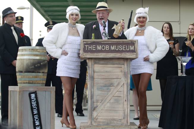 Former Las Vegas Mayor Oscar Goodman holds a bottle of Old Tom Gin during at an event at the Mob Museum Wednesday, Dec. 5, 2012 to publicize a party being held later that evening to mark the end of prohibition. The bottle was found inside the walls when the old federal courthouse was converted into the Mob Museum.