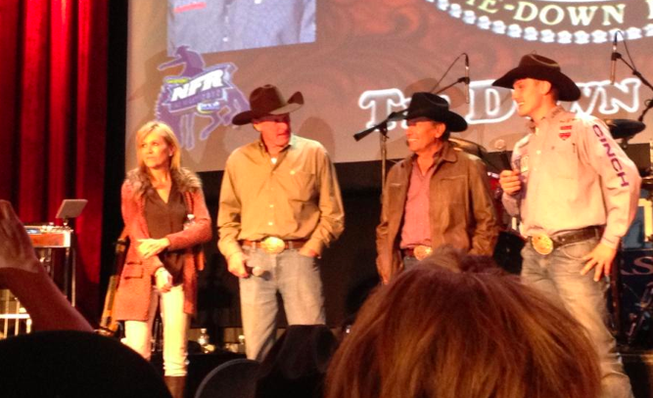 George Strait is brought on stage at the South Point Thursday night following NFR action. 
