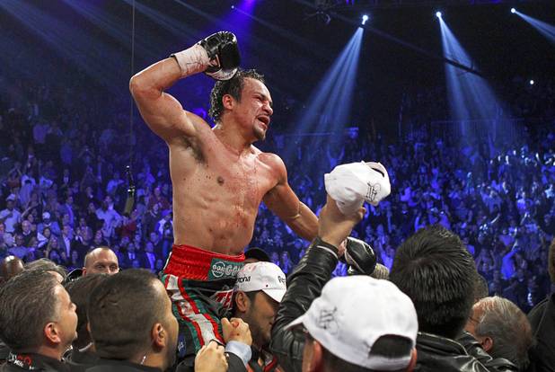 Juan Manuel Marquez of Mexico celebrates his 6th round knock out victory over Manny Pacquiao of the Philippines during their welterweight fight at the MGM Grand Garden Arena in Las Vegas, Nevada December 8, 2012.