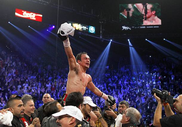 Juan Manuel Marquez of Mexico celebrates his 6th round knock out victory over Manny Pacquiao of the Philippines during their welterweight fight at the MGM Grand Garden Arena in Las Vegas, Nevada December 8, 2012.