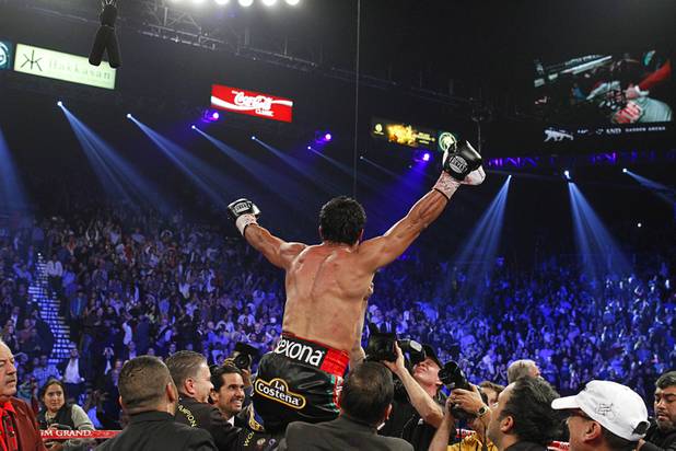 Juan Manuel Marquez of Mexico celebrates his 6th round knock out victory over Manny Pacquiao of the Philippines during their welterweight fight at the MGM Grand Garden Arena in Las Vegas, Nevada December 8, 2012.