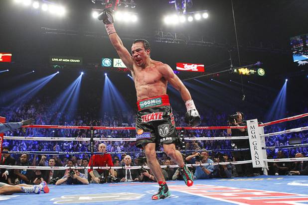 Juan Manuel Marquez of Mexico celebrates his 6th round knock out victory over Manny Pacquiao of the Philippines during their welterweight fight at the MGM Grand Garden Arena in Las Vegas, Nevada December 8, 2012.