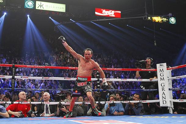 Juan Manuel Marquez of Mexico celebrates his 6th round knock out victory over Manny Pacquiao of the Philippines during their welterweight fight at the MGM Grand Garden Arena in Las Vegas, Nevada December 8, 2012.