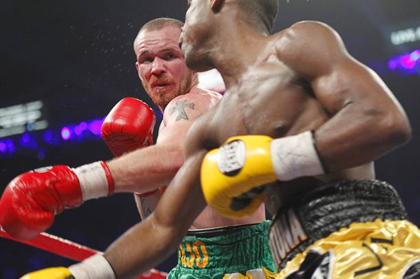 Patrick Hyland (L) of Ireland throws a punch at Javier Fortuna of the Dominican Republic during their WBA interim featherweight fight at the MGM Grand Garden Arena in Las Vegas, Nevada December 8, 2012.