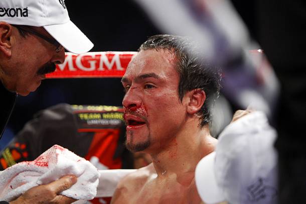 Juan Manuel Marquez of Mexico listens to his trainer Nacho Beristain between rounds during his welterweight fight against Manny Pacquiao of the Philippines at the MGM Grand Garden Arena in Las Vegas, Nevada December 8, 2012.