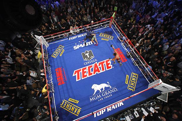 Juan Manuel Marquez of Mexico celebrates as referee Kenny Bayless signals an end to the welterweight fight after Marquez knocked out Manny Pacquiao of the Philippines in the sixth round at the MGM Grand Garden Arena in Las Vegas, Nevada December 8, 2012.