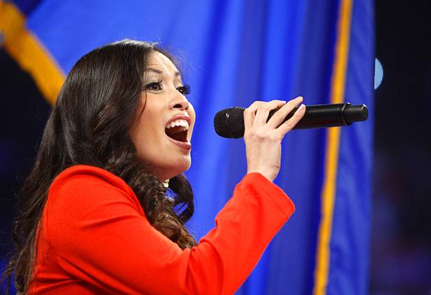 Chelsea Emata sings the Philippine national anthem before the start of a welterweight bout between Manny Pacquiao of the Philippines and Juan Manuel Marquez of Mexico at the MGM Grand Garden Arena in Las Vegas, Nevada December 8, 2012.