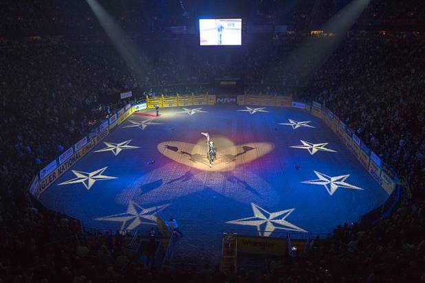 Jason Eagle, top left, sings the national anthem during the fourth go-round of the Wrangler National Finals Rodeo at the Thomas & Mack Center Sunday, Dec. 9, 2012. The NFR continues through Saturday.