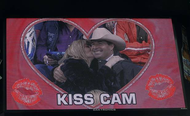 A couple is shown on the "kiss cam" during the fourth go-round of the Wrangler National Finals Rodeo at the Thomas & Mack Center Sunday, Dec. 9, 2012. The NFR continues through Saturday.