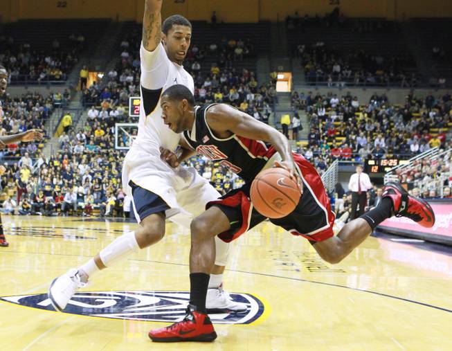 UNLV forward Mike Moser tries to push past Cal forward Richard Solomon during the first half of their game Sunday, Dec. 9, 2012 at Haas Pavilion in Berkeley, Calif. UNLV won 76-75.