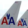 American Airlines planes sit at a gate at Washington's Ronald Reagan National Airport, Nov. 29, 2011. 