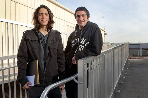 Twins Aalik, left, and Aarik Poeling pose outside a portable ...