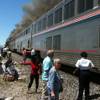 In this photo provided by Ron Almgren, passengers and Amtrak train staff are seen at the site of a collision between an Amtrak westbound train and a truck on  U.S. 95 about four miles south of Interstate 80 on Friday, June 24, 2011, about 70 miles east of Reno, Nev.