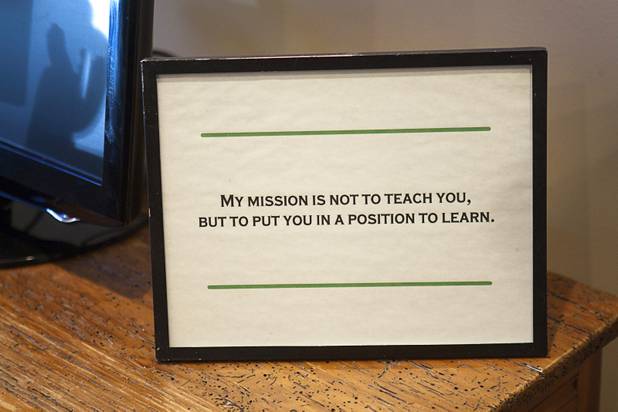 A quote that he framed during his career as a soccer coach is shown at  Scott Martin's home Wednesday, Dec. 12, 2012. Martin wrote a passage for Chicken Soup "Power of Positive" and is working on a memoir.