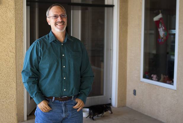 Las Vegas resident Scott Martin, who lost his hands and feet due to the flesh eating disease, is shown at his home Wednesday, Dec. 12, 2012. He wrote a passage for Chicken Soup "Power of Positive" and is working on a memoir.