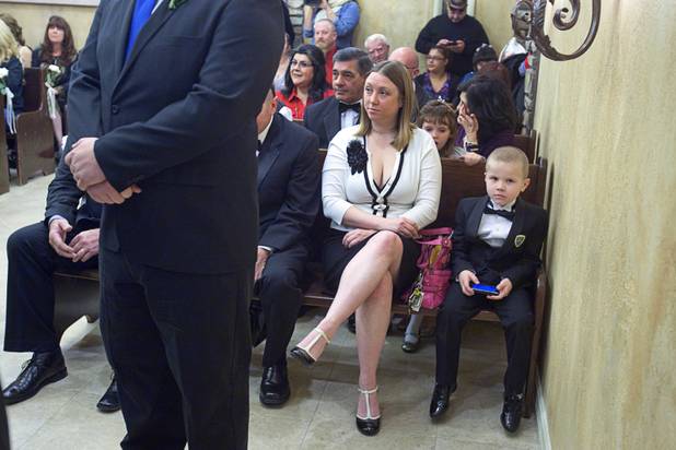 Gabriel Shultz, 5, waits for his parents to be married in a  group wedding at the Chapel of the Flowers on Las Vegas Boulevard South Wednesday, Dec. 12, 2012. Twelve couples got married at 12:12 pm at the chapel as part of a KOMP 92.3 radio station promotion. Las Vegas wedding chapels were busy all day as many couples wanted to get married on the date of 12-12-12.