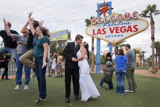 Eric Howell and Paola Teran of Stanton, Calif. kiss after getting married in Las Vegas, Nevada December 12, 2012. Las Vegas wedding chapels were busy all day as many couples wanted to get married on the date of 12-12-12.