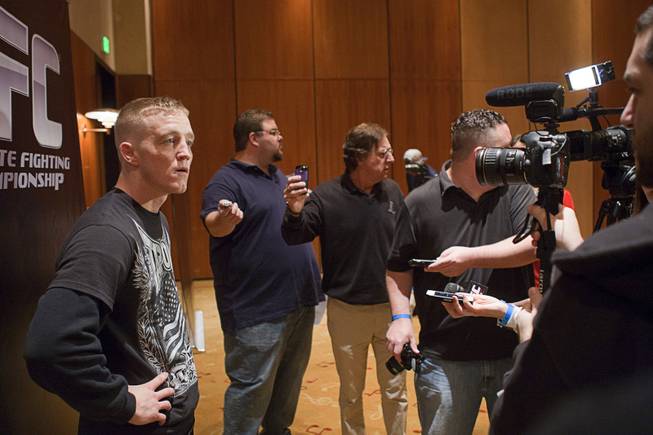 Welterweight fighter Colton Smith, left, talks with reporters during UFC Ultimate Fighter Finale workouts at the Hard Rock Thursday, Dec. 13, 2012.