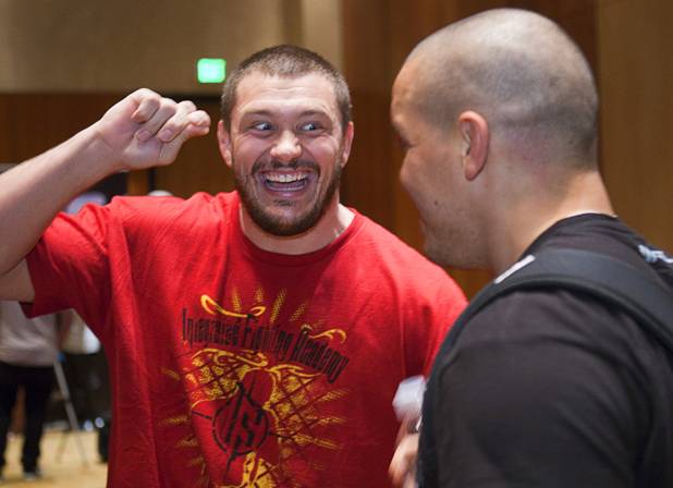 Heavyweight fighter Matt Mitrione, left, jokes with fighter Pat Barry during UFC Ultimate Fighter Finale workouts at the Hard Rock Thursday, Dec. 13, 2012.