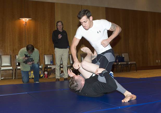 Welterweight fighter Mike Ricci, right, works out with James Polodna during UFC Ultimate Fighter Finale workouts at the Hard Rock Thursday, Dec. 13, 2012.