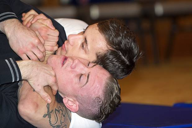 Welterweight fighter Mike Ricci, top, wrestles with James Polodna during UFC Ultimate Fighter Finale workouts at the Hard Rock Thursday, Dec. 13, 2012.