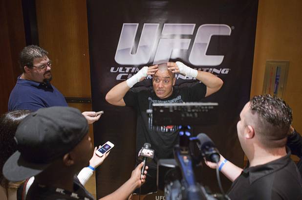 Heavyweight fighter Pat Barry talks to reports about his hairstyle during UFC Ultimate Fighter Finale workouts at the Hard Rock Thursday, Dec. 13, 2012.