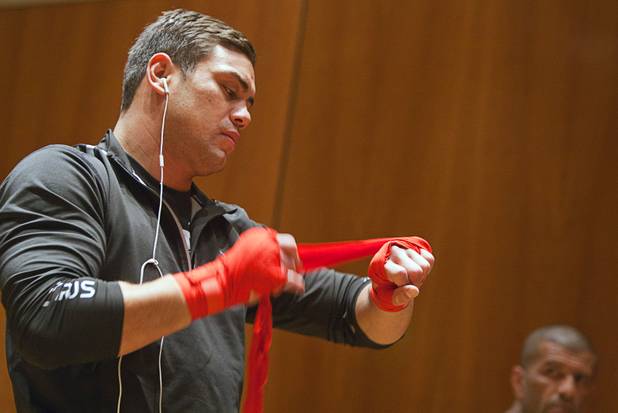 Heavyweight fighter Shane Del Rosario wraps his hands during UFC Ultimate Fighter Finale workouts at the Hard Rock Thursday, Dec. 13, 2012.