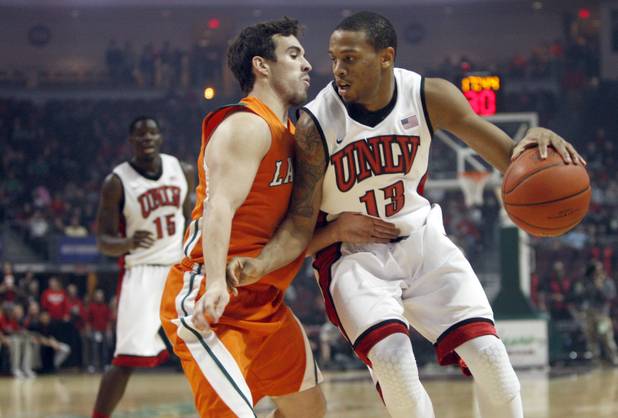 UNLV's Bryce Dejean-Jones, right, is guarded by Jake Vieth during UNLV's game against the La Verne Leopards at the Orleans Arena Thursday, Dec. 13, 2012.