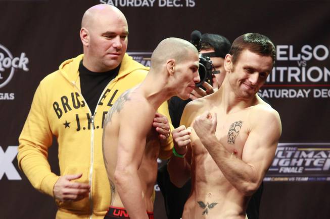 Timothy Elliot backs away from Jared Papazian while they face off during weigh-ins for the Season 16 finale of "The Ultimate Fighter" Friday, Dec. 14, 2012, at the Joint in the Hard Rock Hotel.