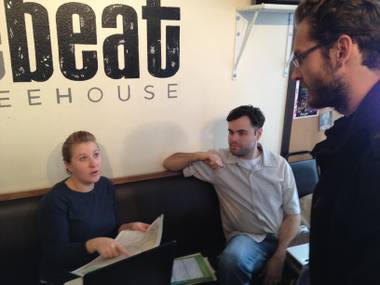 Rae Lathrop and Graham Wimbrow (seated from left), of the Outside Las Vegas Foundation, talk with Czech exchange student Stepan Kucera. In Las Vegas on a break from school, Kucera wanted to walk from Fremont Street to Sunrise Mountain. Lathrop and Wimbrow had detailed maps that demonstrated the length and difficulty of getting to that destination from Fremont Street.