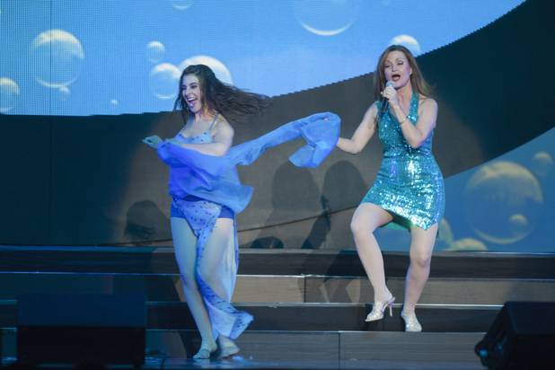 Michelle Rohl, right, a MGM employees services specialist, performs with Jenny Annon during a dress rehearsal for MGMs Inspiring Our World show, an event featuring MGM employees, at the Mandalay Bay Events Center Saturday, Dec. 15, 2012.
