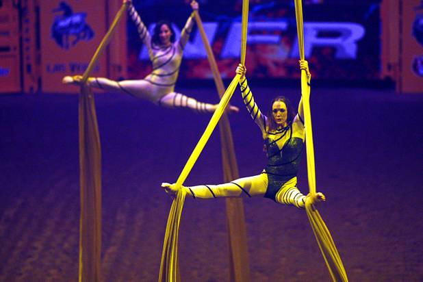 Silk aerialists perform during the final night of the Wrangler National Finals Rodeo Saturday, Dec. 15, 2012.