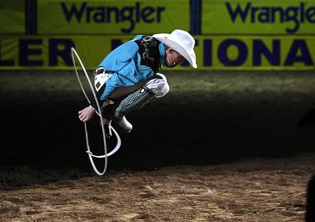 A trick roper performs during the final night of the Wrangler National Finals Rodeo Saturday, Dec. 15, 2012.