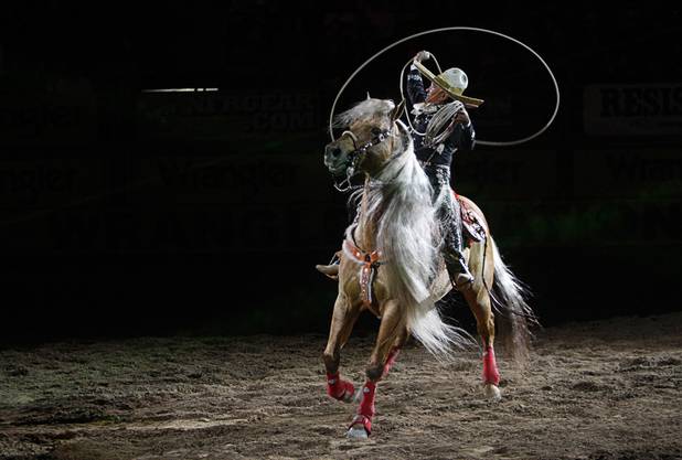 Trick roper Tomas Garcilazo performs during the final night of the Wrangler National Finals Rodeo Saturday, Dec. 15, 2012.