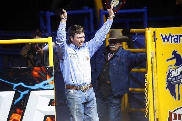 Team roper Jade Corkill of Fallon, Nev. is introduced after winning the world title during the final night of the Wrangler National Finals Rodeo Saturday, Dec. 15, 2012. Team ropers split the world championship with heeler Jade Corkill and header Chad Masters of Cedar Hill, Tenn. winning championships.