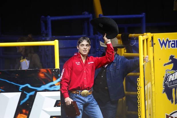 Saddle bronc rider Jesse Wright of Milford, Utah is introduced after winning the world title during the final night of the Wrangler National Finals Rodeo Saturday, Dec. 15, 2012.