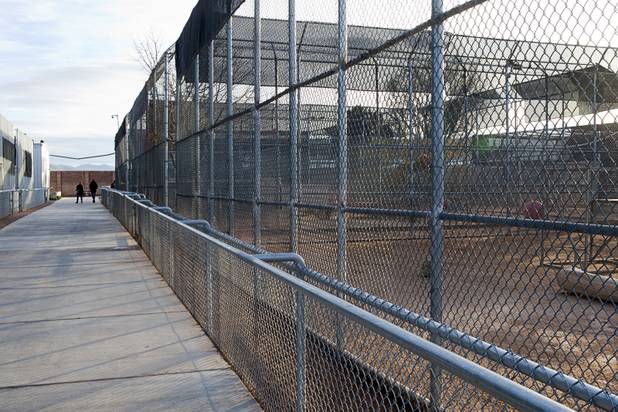 A couple walks by lion cages at the Lion Habitat Ranch in Henderson Sunday, Dec. 16, 2012. The habitat used to provide lions to the lion habitat at the MGM Grand but is now open to the public. The MGM's lion habitat closed in January 2012.