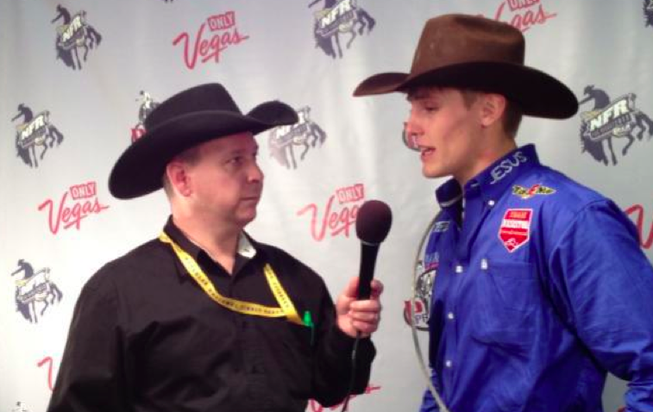Tuf Cooper talks to the media after winning his second Professional Rodeo Cowboys Association World Champion title in Tie-Down Roping Saturday night at the Wrangler National Finals Rodeo in Las Vegas.