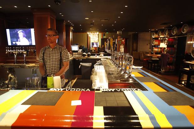 Bartender Adam O'Donnell stands by a bar in the Gordon Ramsay Pub & Grill in Caesars Palace Monday, Dec. 17, 2012.