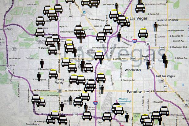 Taxis and customers are displayed on a computer screen during ...