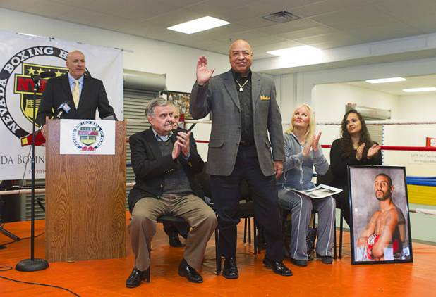Former referee Joe Cortez, center, waves as he is introduced during a Nevada Boxing Hall of Fame (NVBHOF) news conference at the Richard Steele Boxing Club in North Las Vegas Wednesday, Dec. 19, 2012. Induction will take place in 2013.