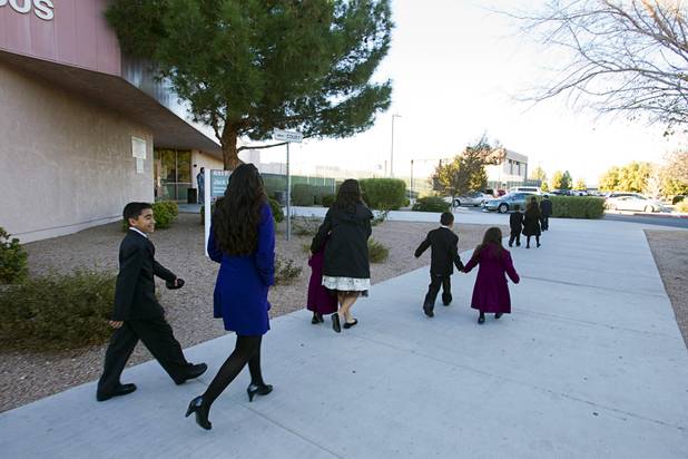 The Maciel children head to their van after an adoption proceeding at family court Thursday, Dec. 20, 2012. The family officially adopted four more children for a total of eleven children.