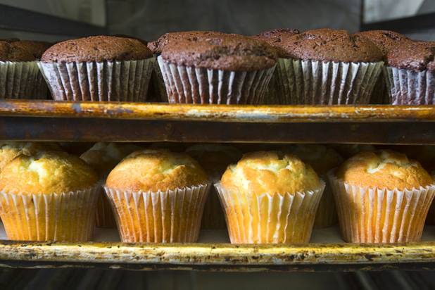 Cupcakes wait to be decorated at Chef Flemmings Bake Shop, a European-style bakery, on Water Street in downtown Henderson Thursday, Dec. 20, 2012.
