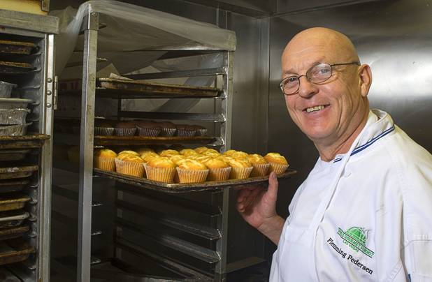 Chef Flemming Pedersen poses by a rack of cupcakes at Chef Flemmings Bake Shop, a European-style bakery, on Water Street in downtown Henderson Thursday, Dec. 20, 2012.