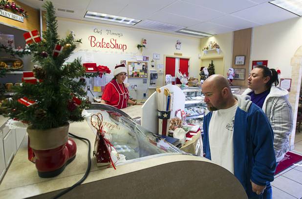 Customers Michael and Nataliya Malkin check out baked goods and pastries at Chef Flemmings Bake Shop, a European-style bakery, on Water Street in downtown Henderson Thursday, Dec. 20, 2012.