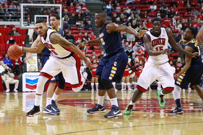 UNLV guard Anthony Marshall and forward Anthony Bennett make their way through the Canisius defense during their game Saturday, Dec. 22, 2012 at the Thomas & Mack. The Runnin' Rebels won 89-74.
