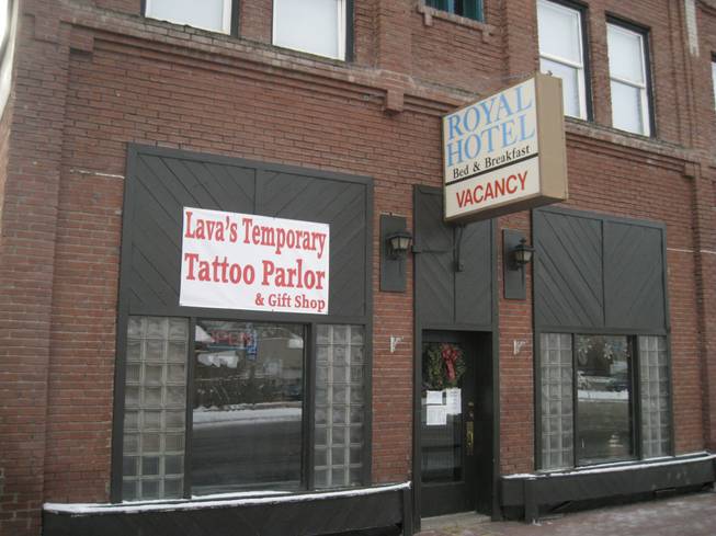 Temporary tattoos next to the Royal Hotel, Saturday, Dec. 22, 2012.