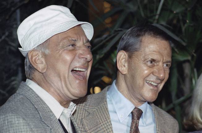 In this Dec. 3, 1992, file photo, Jack Klugman, left, and Tony Randall laugh at a news conference announcing that they will reprise their most famous roles as Oscar Madison and Felix Unger respectively, for a one-night benefit performance of Neil Simons play, "The Odd Couple," in Beverly Hills, Calif. Klugman, the prolific, craggy-faced character actor and regular guy who was loved by millions as the messy one in TV's "The Odd Couple" and the crime-fighting coroner in "Quincy, M.E.," died Monday, a son said. He was 90.