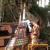 A crew member paints the pirate ship used in "The Sirens of TI" during dry dock, when water is drained from the bay for maintenance and repairs, at Treasure Island.